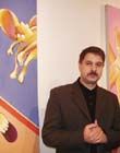 Александр Савко на фоне работ из серии "Фрэнсис Бэкон в гостях у Симпсона"